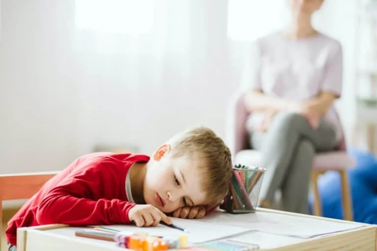 Tired boy at school